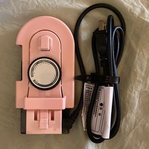Pink travel iron